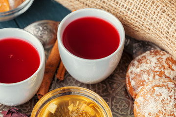 Cup of freshly brewed fruit and herbal tea, dark mood.Tea ceremony