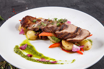 Close up view on tasty grilled and roasted beef with potato, forest mushroom on white plate. Restaurant food for lunch. Food photo background with copy space. Steak