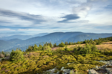 Amazing view from summer mountain ridge under blue sky