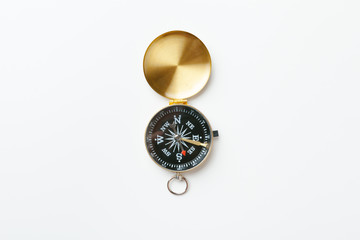 Golden vintage compass isolated on white background © NewFabrika