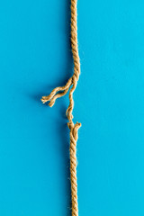 stress concept with breaking rope on blue background top view mockup
