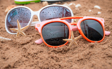 Fototapeta na wymiar Summer beach sea accessories on sand beach, Summer background Holiday vacation travel concept