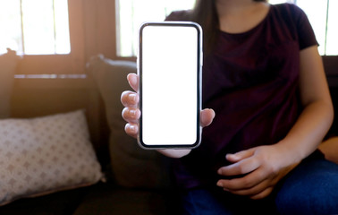 Women's hands holding cell telephone blank copy space screen. smart phone with technology concept.