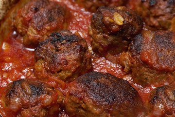 hommade meatballs in tomato and basil sauce. full frame