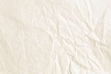 Old pale brown crumpled paper background texture