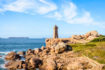 Fototapeta na wymiar Landscape on the Pink Granite Coast in northern Brittany on the municipality of Perros-Guirec, France, with the Ploumanac'h lighthouse, named Mean Ruz and made of the same pink granite.