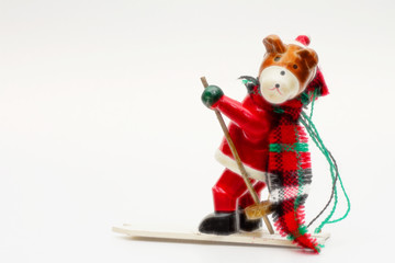 Decorative fun christmas bear skiing on white background