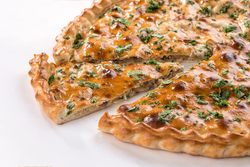 Homemade pie slice stuffed with potato and mushrooms isolated on white background