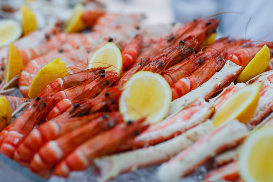 King prawns lay on the table with lemon