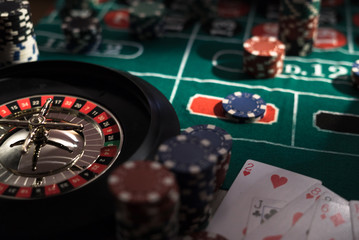 Roulette table and stack of poker chips, Casino, gambling and entertainment concept  photo