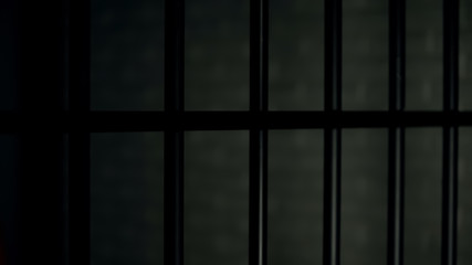 Dark individual prison cell, sign of criminal world, law and order, justice