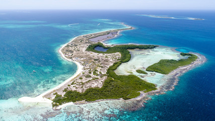 Obraz na płótnie Canvas Caribbean: Vacation in the blue sea and deserted islands. Aerial view of a blue sea with crystal water. Great landscape. Beach scene. Aerial View Island Landscape Los Roques