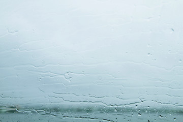 Rain falling on a window glass