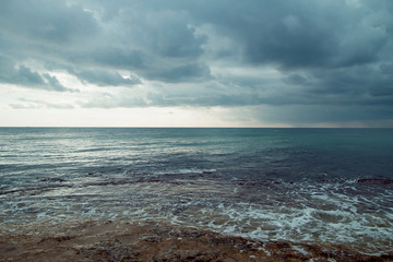 A stormy landscpe by the sea