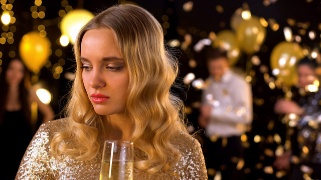 Sad Blond Woman Feeling Lonely At Party, Dancing People On Background, Offence