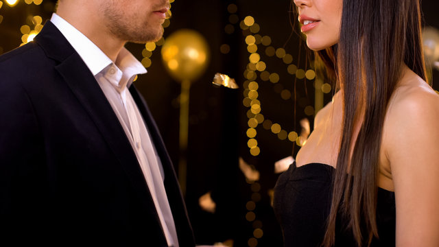 Male and female looking at each other at party, love from first sight, affection
