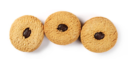 Integral cookies, biscuits with apricot jam filling isolated on white background, top view