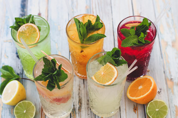 fresh fruit and vegetable juice on wooden background