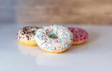 three delicious donuts on white background