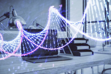 Obraz premium DNA hologram with desktop office background. Double exposure. Concept of education