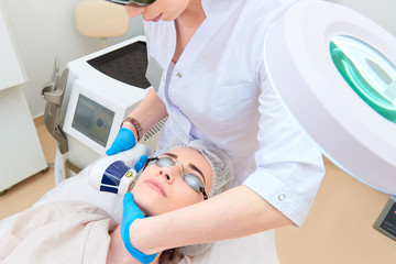 Laser procedure in the clinic of laser cosmetology.
