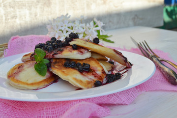Cottage cheese pancakes with jam. Russian rustic cuisine. Concept healthy Breakfast.