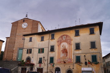 Collegiata of John the Baptist and fresco of San Cristoforo in Piazza Vittorio Veneto in Fucecchio, Tuscany, Italy