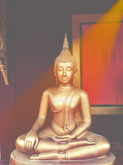 golden buddha statue, The face of gold buddha statue, Close up of the old Thai buddha with wooden wall background in art of religion concept