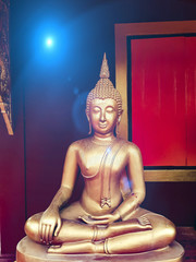 golden buddha statue, The face of gold buddha statue, Close up of the old Thai buddha with wooden wall background in art of religion concept