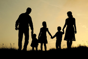 Fototapeta na wymiar silhouette of a happy family with children