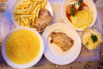 Complete lunch on a tray in the dining room. First, second and salad for business lunch