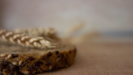 Wheat ears on rustic wooden background. Spikelets of wheat on old wooden table background.