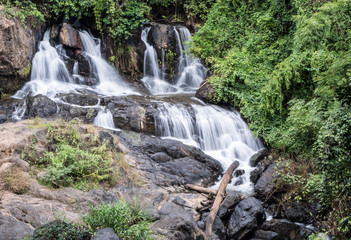 Fototapeta na wymiar Fresh waterfall from the granite cliff.