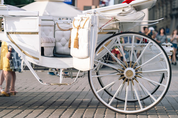 Closeup white carriage in Krakow (Cracow ) on the street