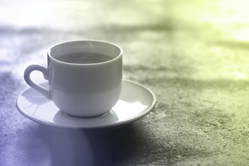 Hot cup of espresso coffee on a table