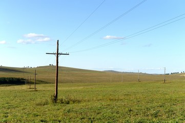 Fototapeta na wymiar Power line in the foothills of the Altai territory. Western Siberia. Russia