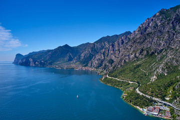 Fototapeta na wymiar Panorama of Lake Garda surrounded by mountains in Riva del Garda, Italy. Lake Garda Italy. Aerial view