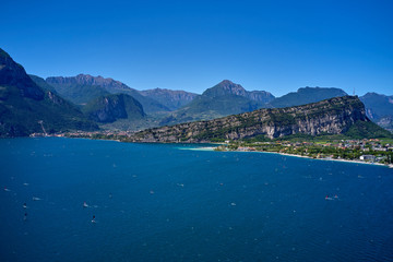 Naklejka premium Panorama of Lake Garda surrounded by mountains in Riva del Garda, Italy. Lake Garda Italy. Aerial view