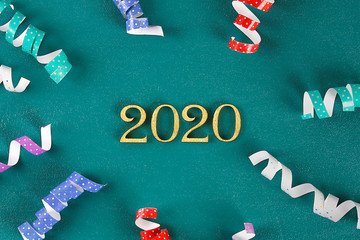 Happy New Year 2020. Creative text Happy New Year 2020 written in gold wooden letters.