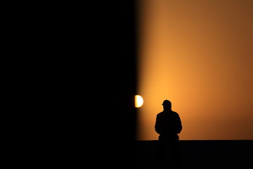 Silhouette of  person watching the sunset - 285455720