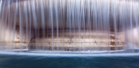 flowing water of fountain stream background