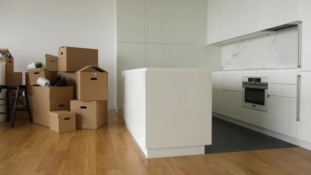 Cardboard boxes and chairs in the interior of an apartment
