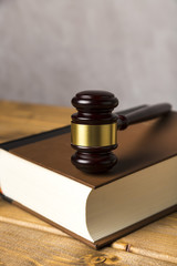 Close-up with judge gavel on a book