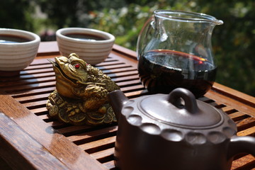 Chinese tea ceremony using tea utensils in nature.