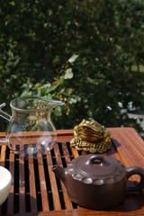 Chinese tea ceremony using tea utensils in nature.