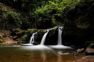 Fototapeta na wymiar Schiessentümpel waterfalls in Mullerthal, Luxembourg
