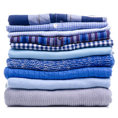 Stack folded blue shirt clothing on white background isolation