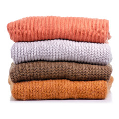 Stack folded sweater clothing on white background isolation