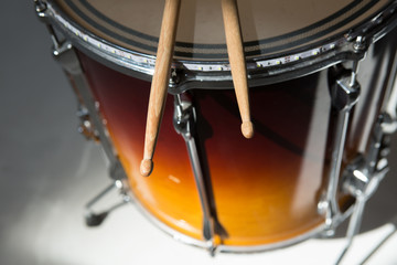 percusions drums with drumsticks on it close-up