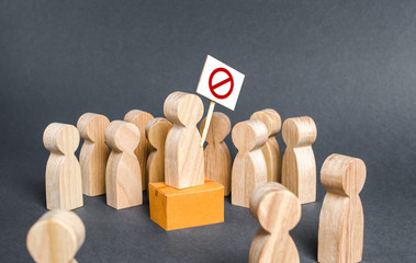 A crowd of people surrounds a picketing man. Call for protests. Drawing public attention to the...